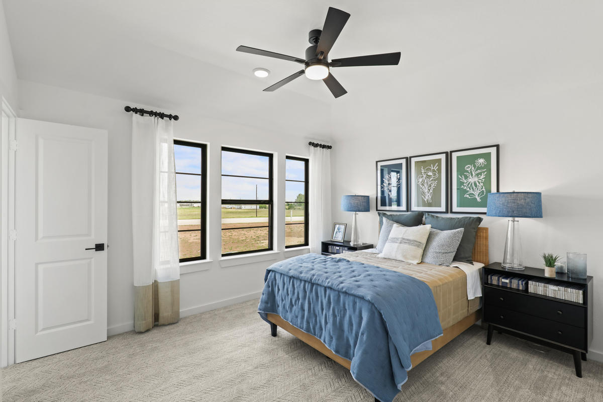 photo showing the secondary bedroom of the Vienna model of Newmark homes in Harvest Green in Richmond Texas